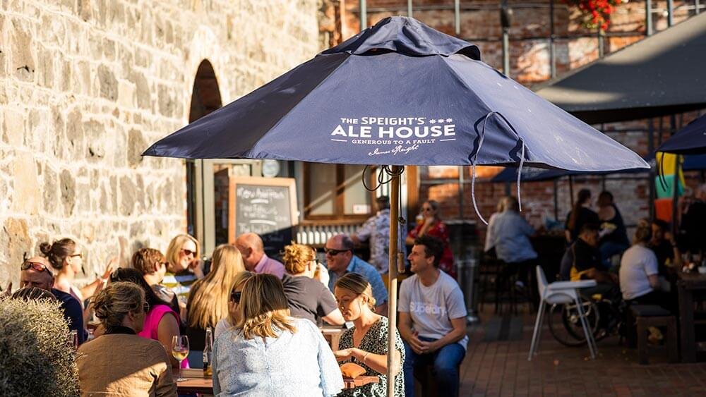 Outdoor dining scene at Speight’s Ale House with patrons enjoying warm, inviting atmosphere supported by discreetly installed Kelray heaters